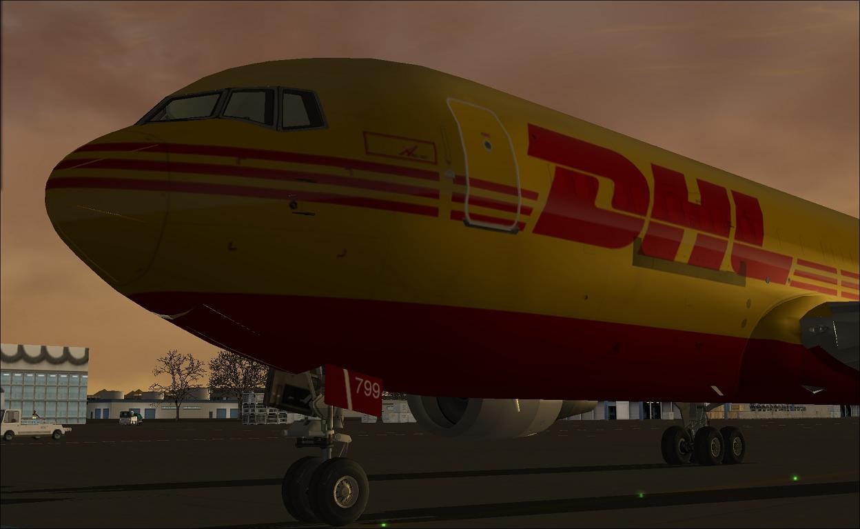 6973